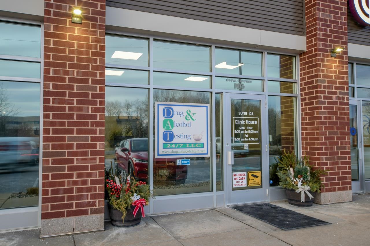 Commercial storefront with brick facade, glass entrance, and Drug & Alcohol Testing clinic signage.
