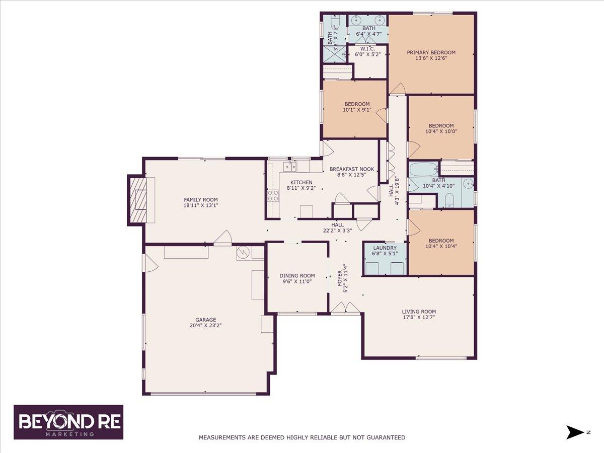 Floor plan showing four bedrooms, multiple living areas, kitchen, laundry, and an attached garage.