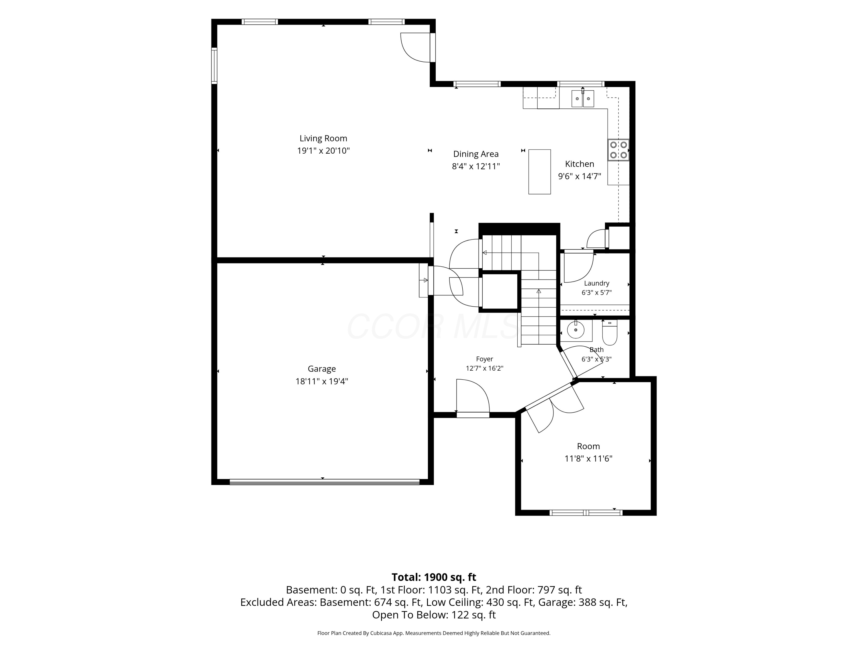 Floor plan showing the home’s living room, kitchen, garage, foyer, and room dimensions.