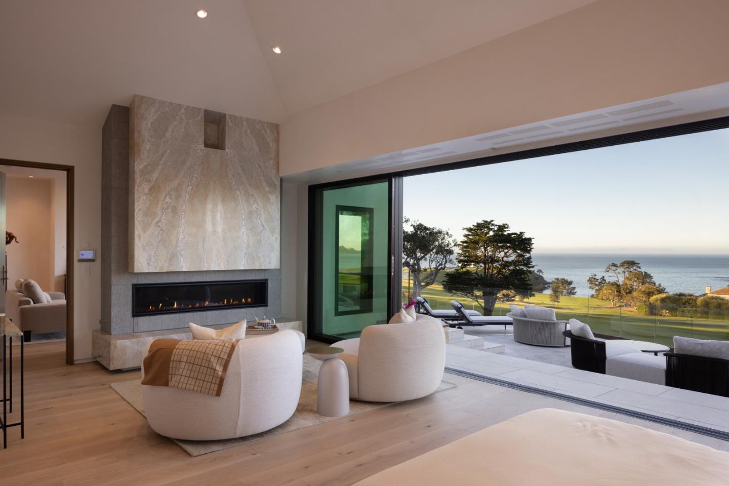 Living room in a Pebble Beach home overlooking the golf course and ocean