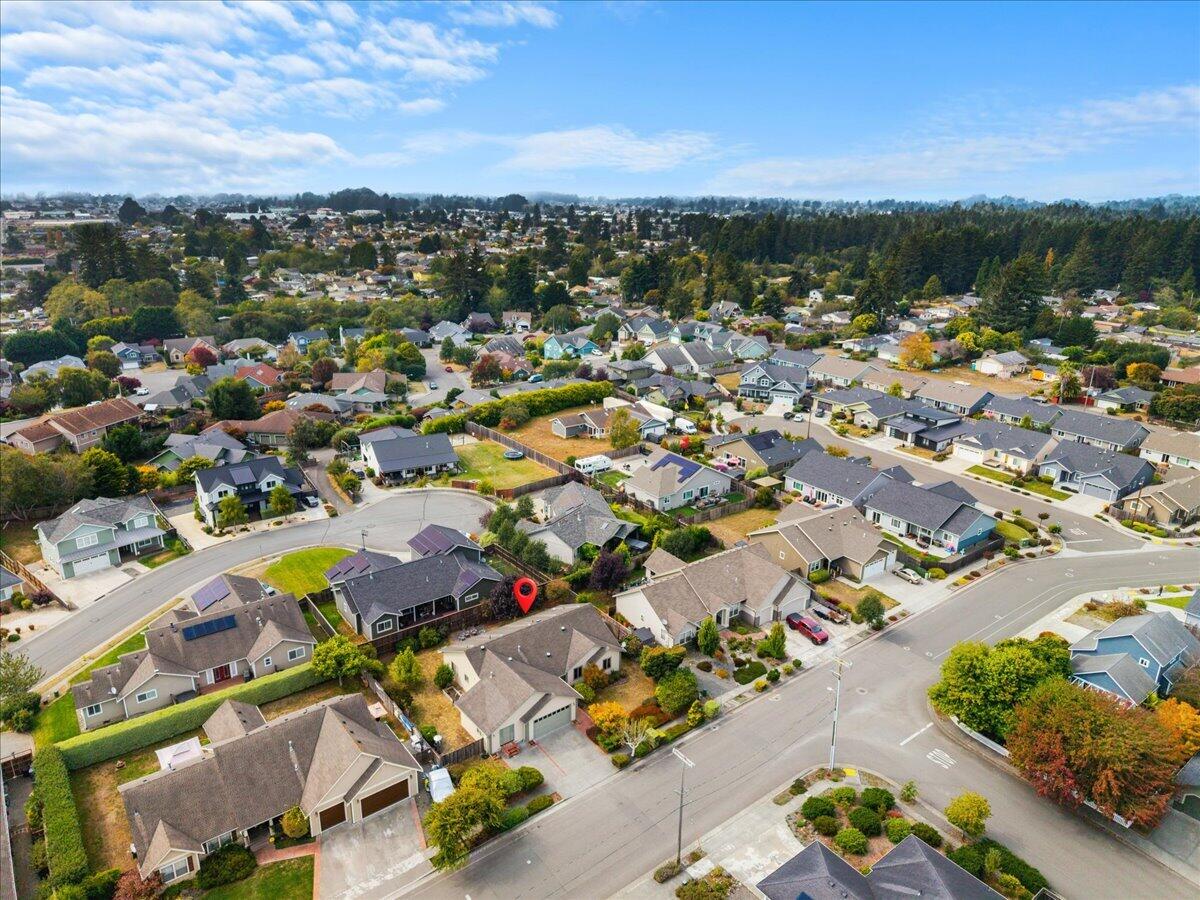 Aerial view of the McKinleyville neighborhood, with a red marker indicating the property.