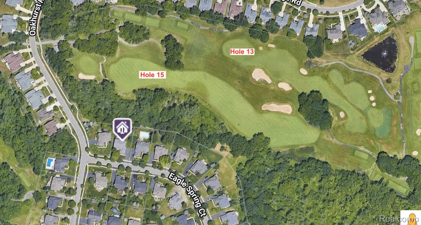 Aerial view of the home site beside golf course holes 13 and 15.