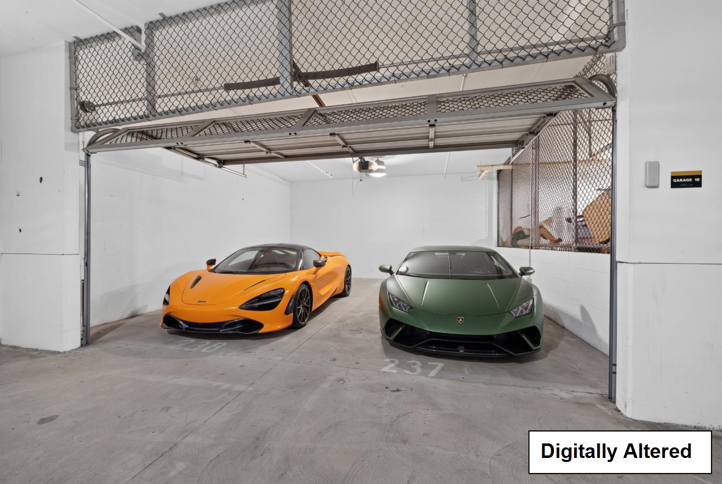 Two sports cars parked side by side in a garage beneath a raised metal storage platform.