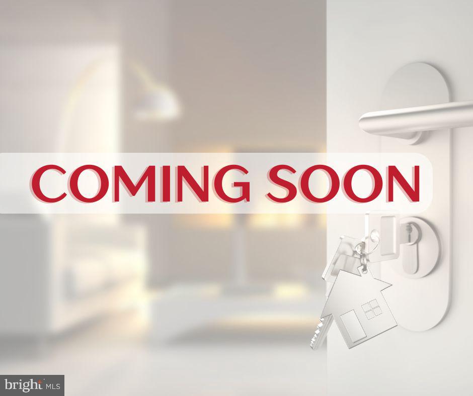 Coming soon real estate graphic with keys hanging from a door lock.