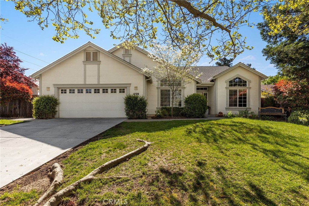 House at 459 Palisades Drive with a two-car garage, broad driveway, and leafy front lawn.