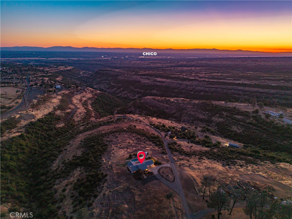 Aerial view of rural property near Chico at sunset, marked by a red location pin.