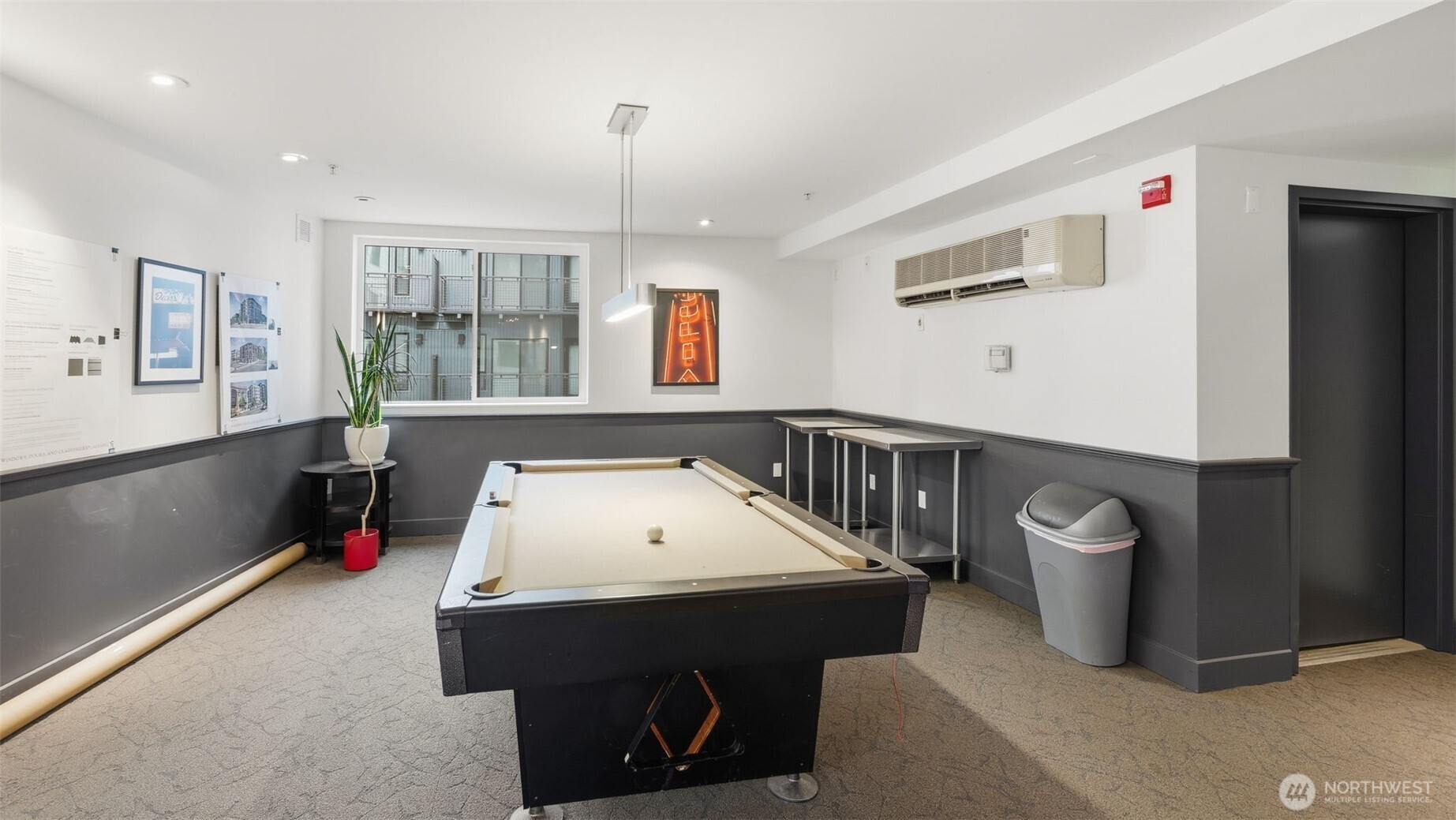 Game room with a full-size pool table, high-top tables, and a framed neon OPEN sign.