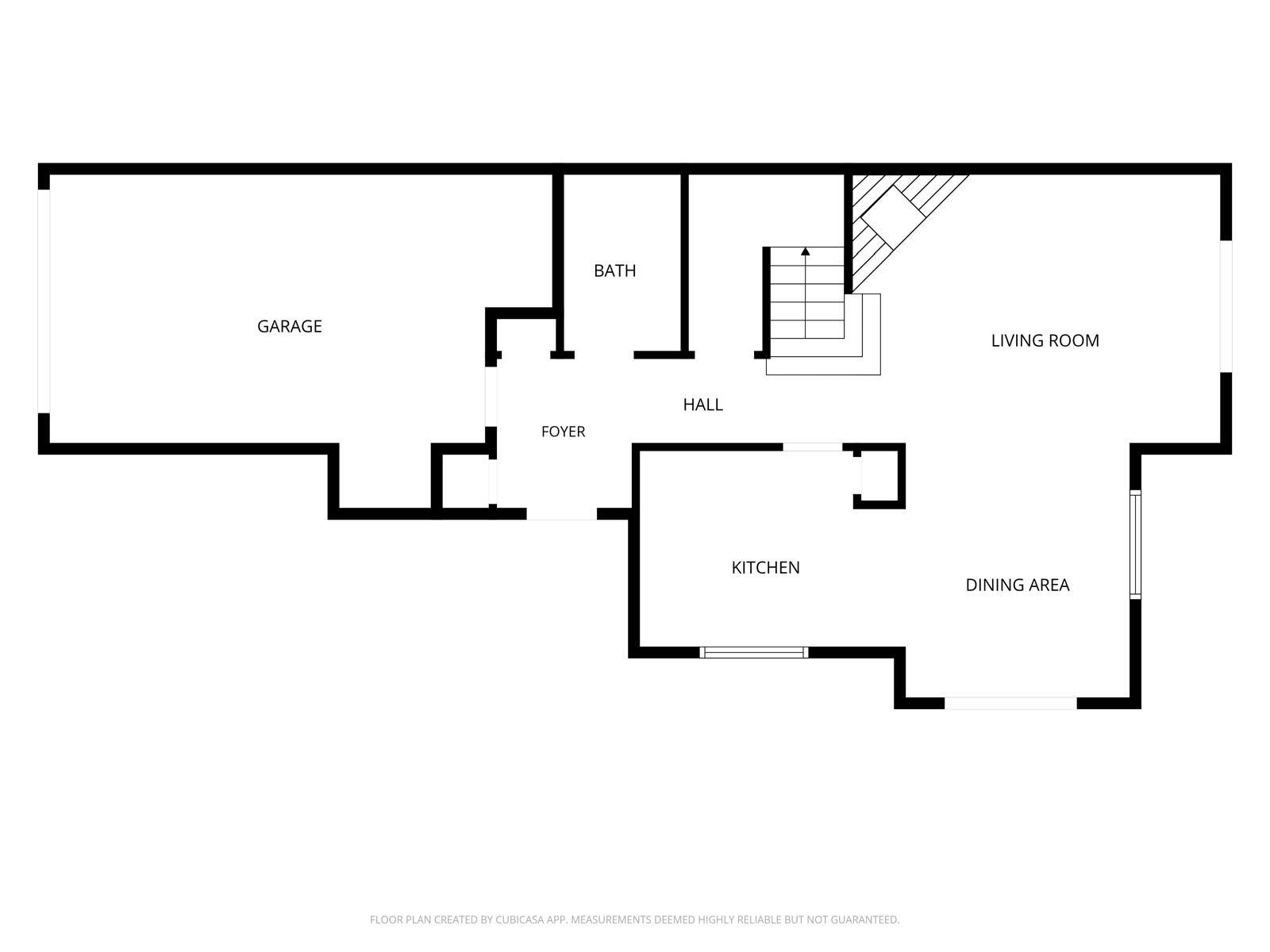 Floor plan showing the garage, bath, living room, hall, foyer, kitchen, and dining area.