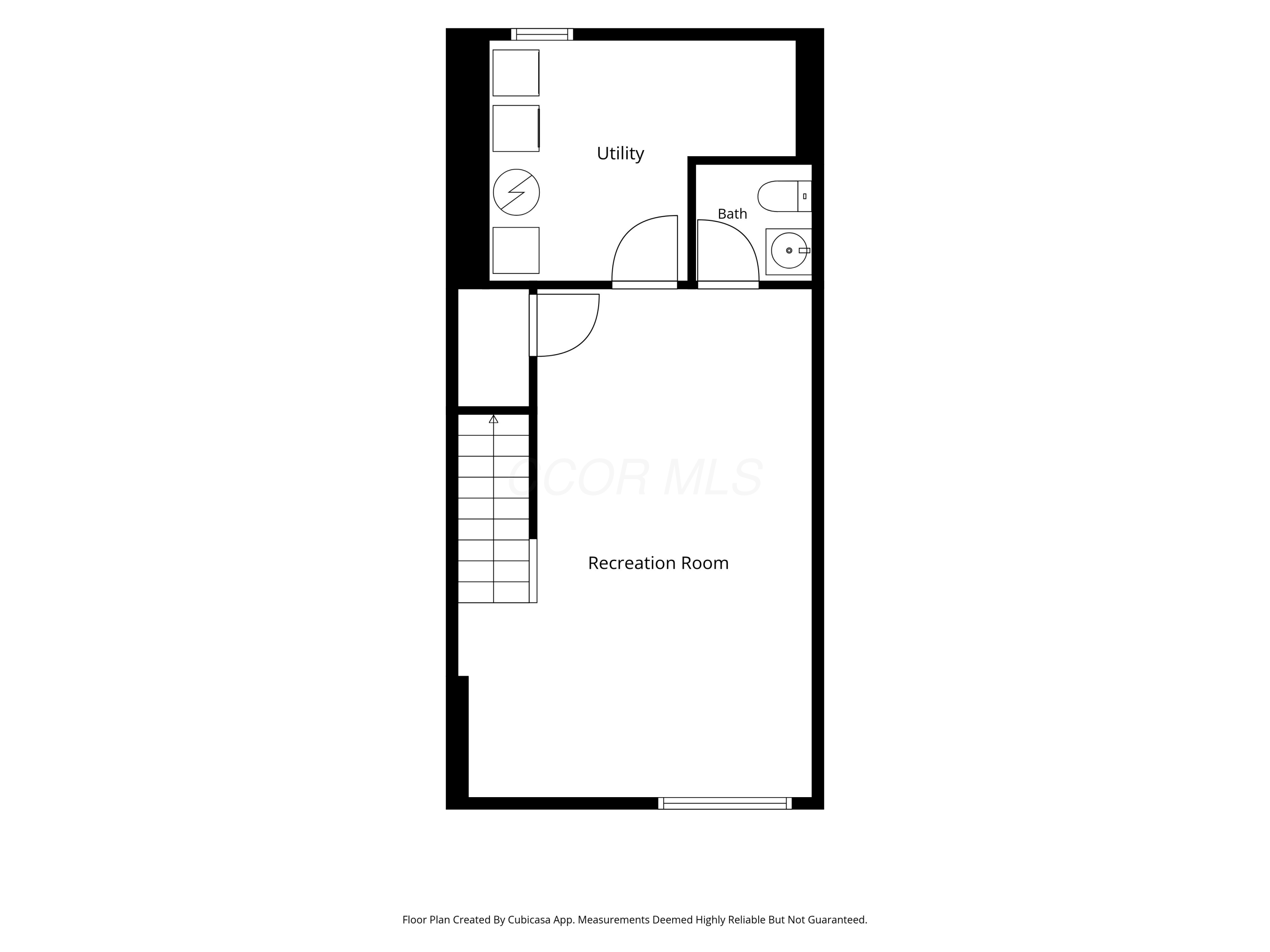 Floor plan showing a large recreation room, utility room, bathroom, and staircase.