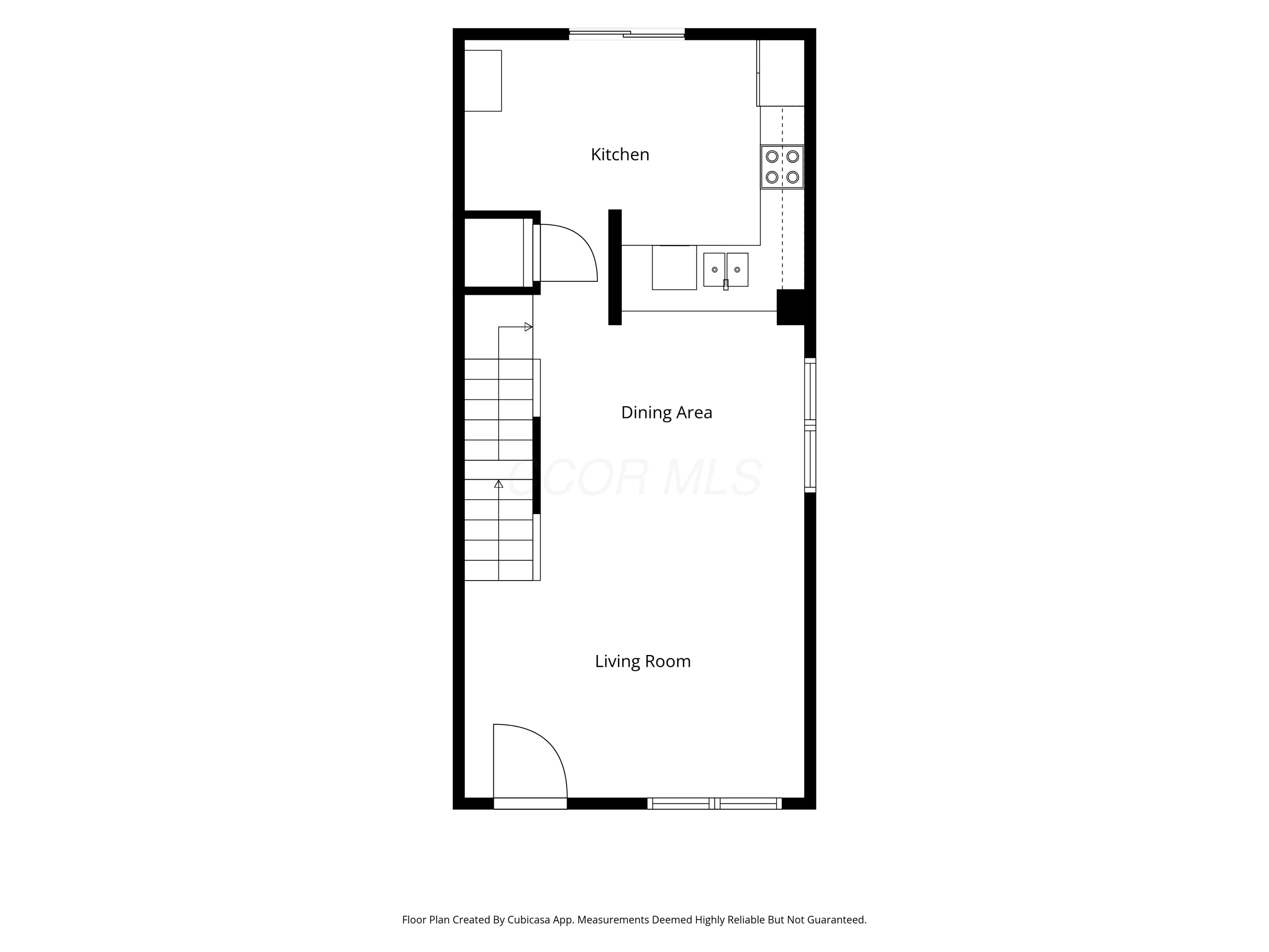 Floor plan showing the kitchen, dining area, living room, staircase, doors, and windows.