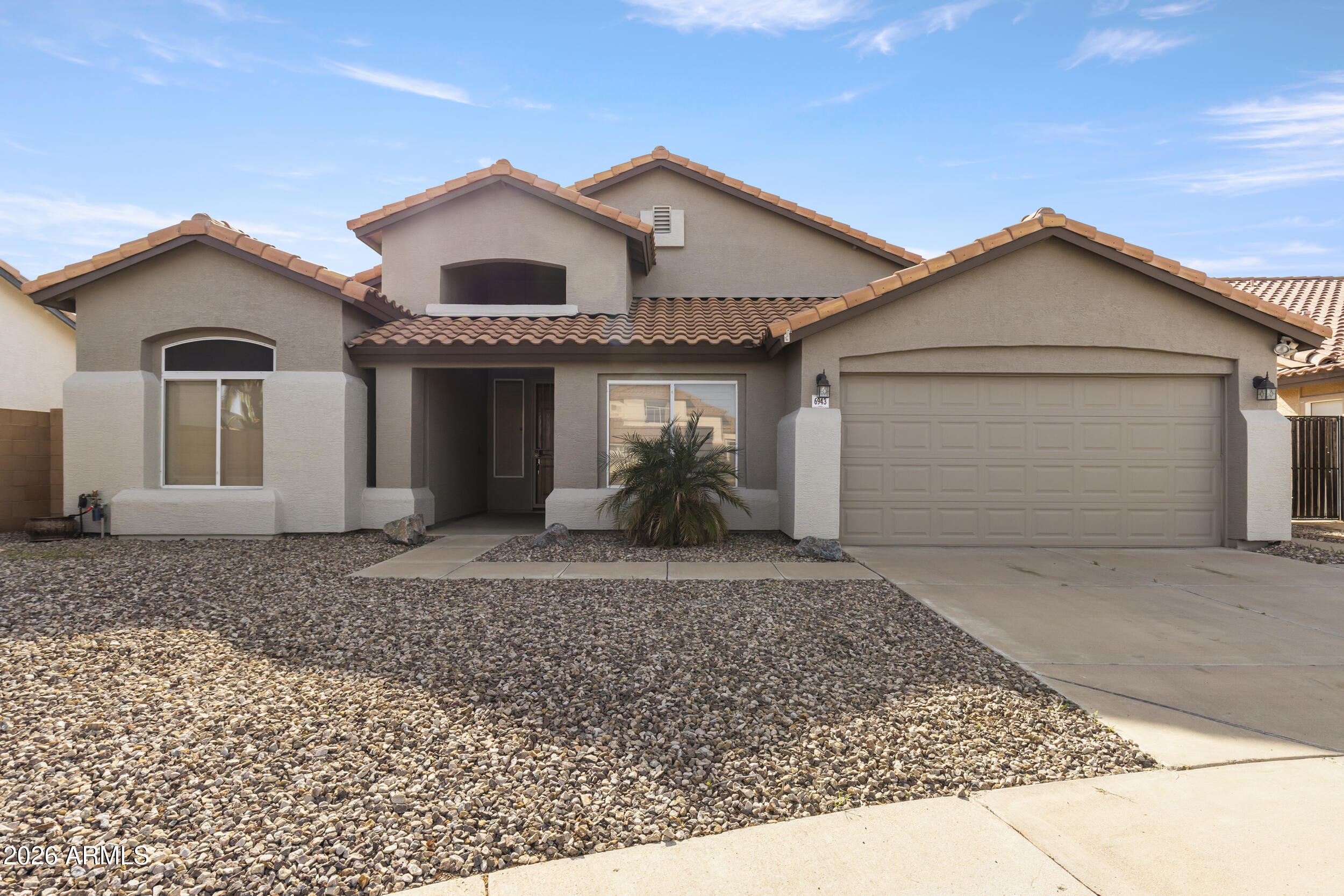 6943 W LAREDO Street
