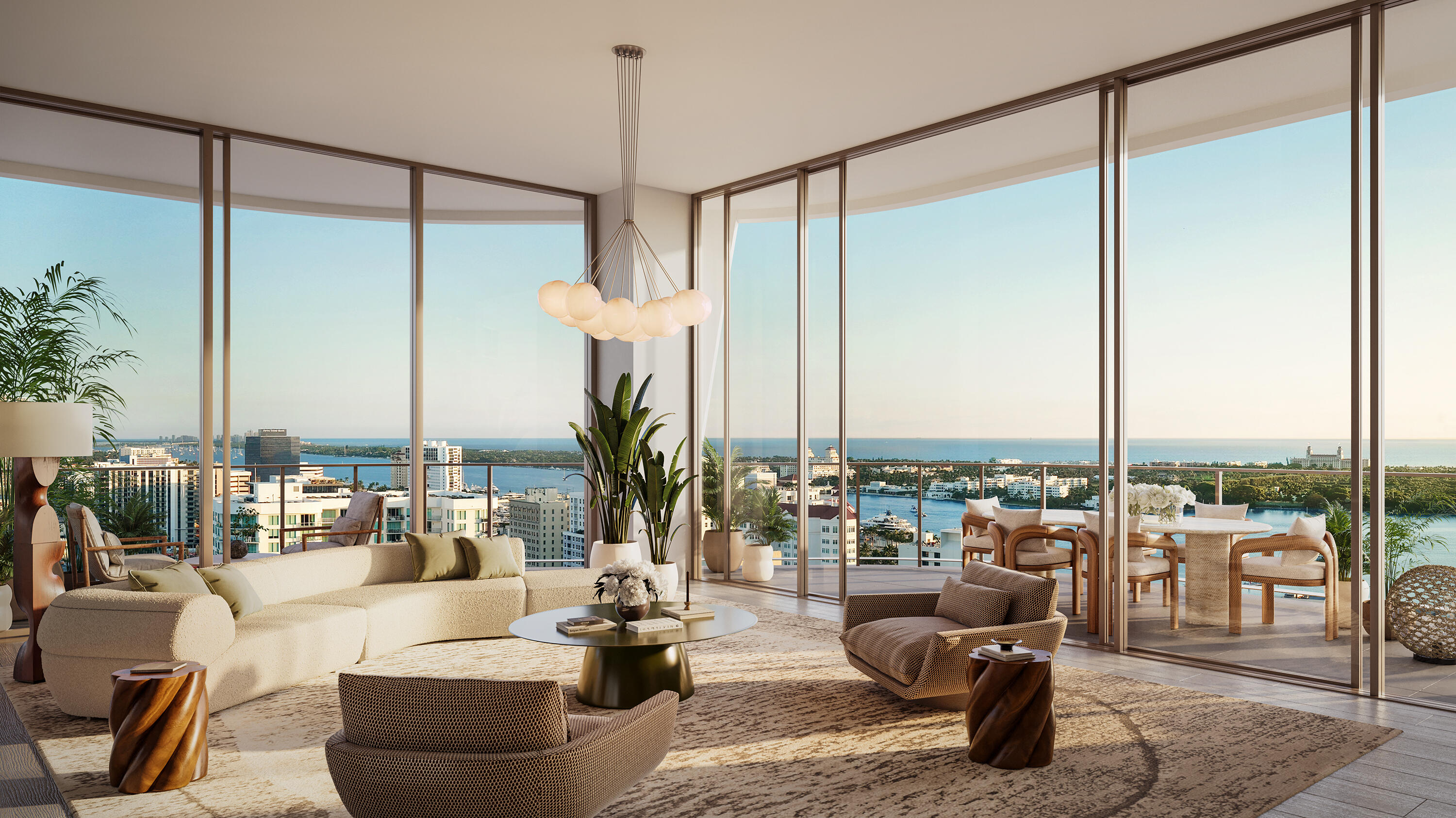 Living room with floor-to-ceiling windows overlooking the West Palm Beach skyline and water.