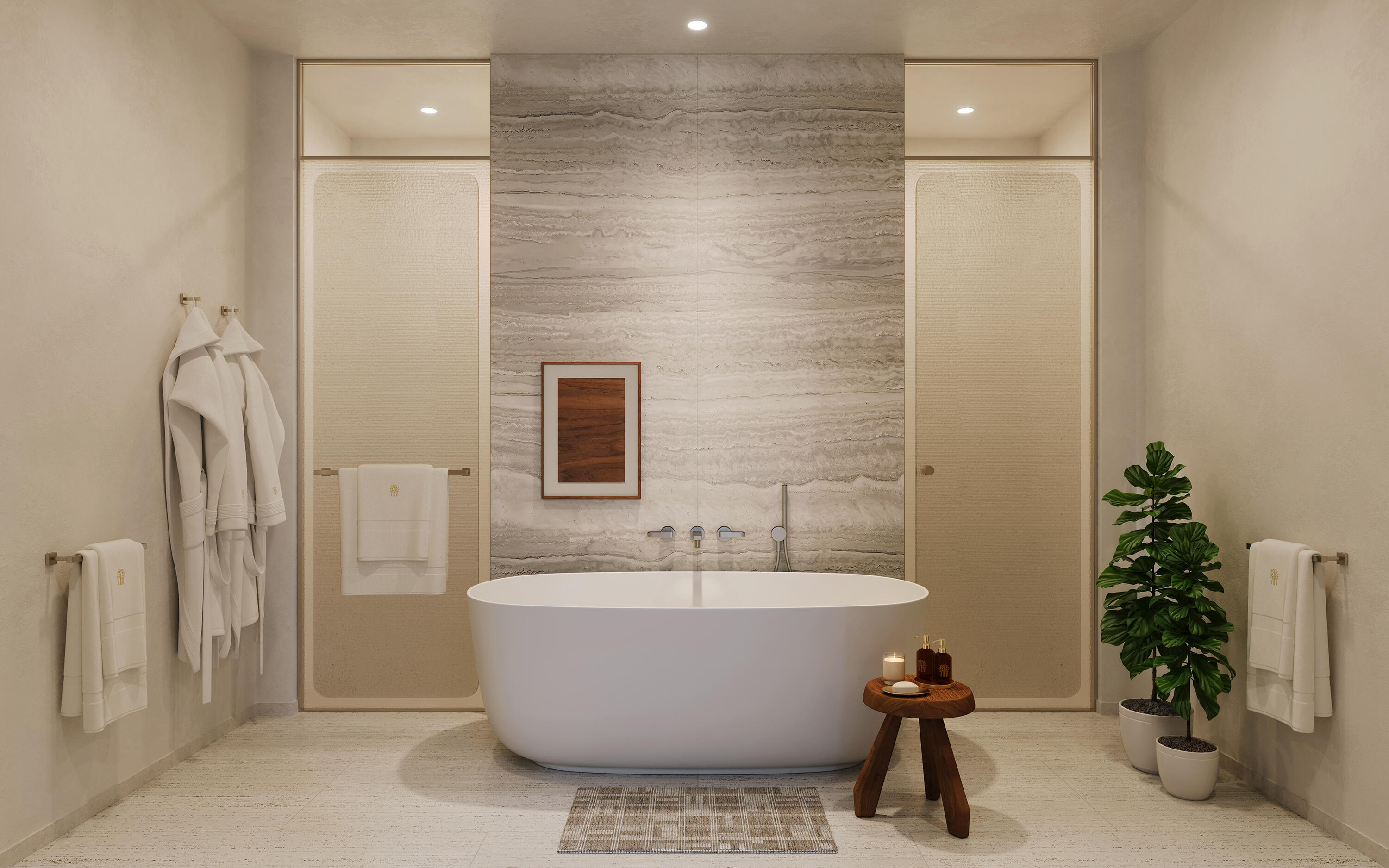 Luxury bathroom with a freestanding tub beneath a veined stone wall.