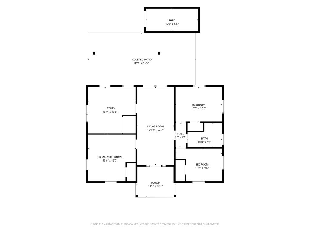 Floor plan showing three bedrooms, a kitchen, living room, bath, porch, covered patio, and shed.