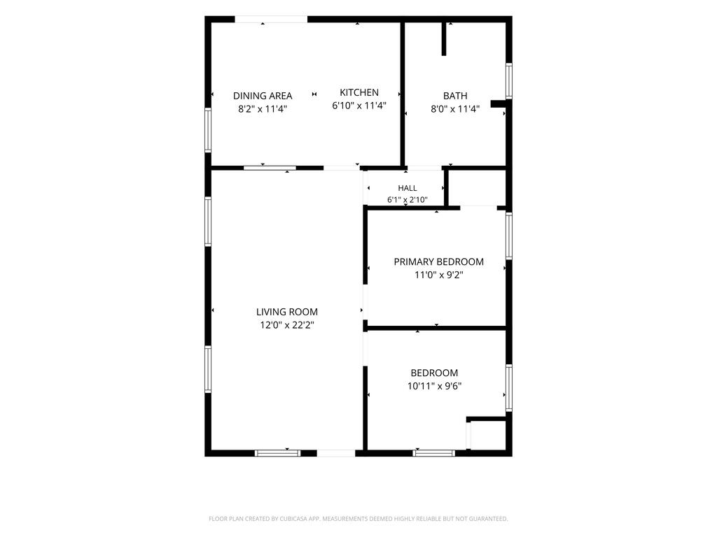 Floor plan showing the living room, dining area, kitchen, bathroom, hall, and two bedrooms.