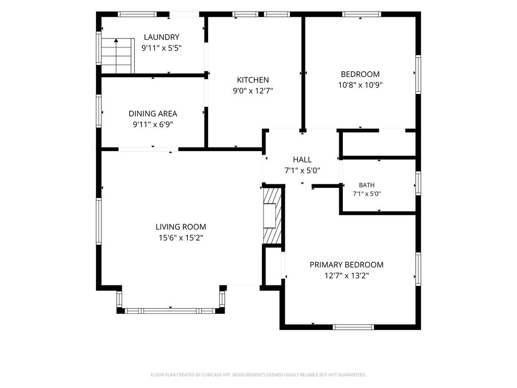 Floor plan showing living and dining areas, kitchen, laundry, bathroom, and two bedrooms.