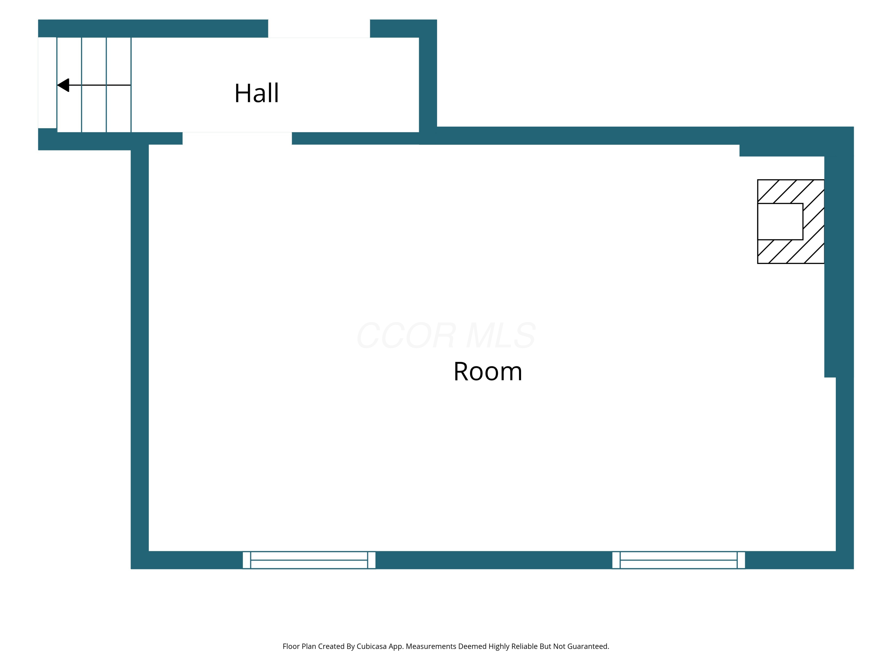 Floor plan showing a large room connected to a hall, with windows and a fireplace.