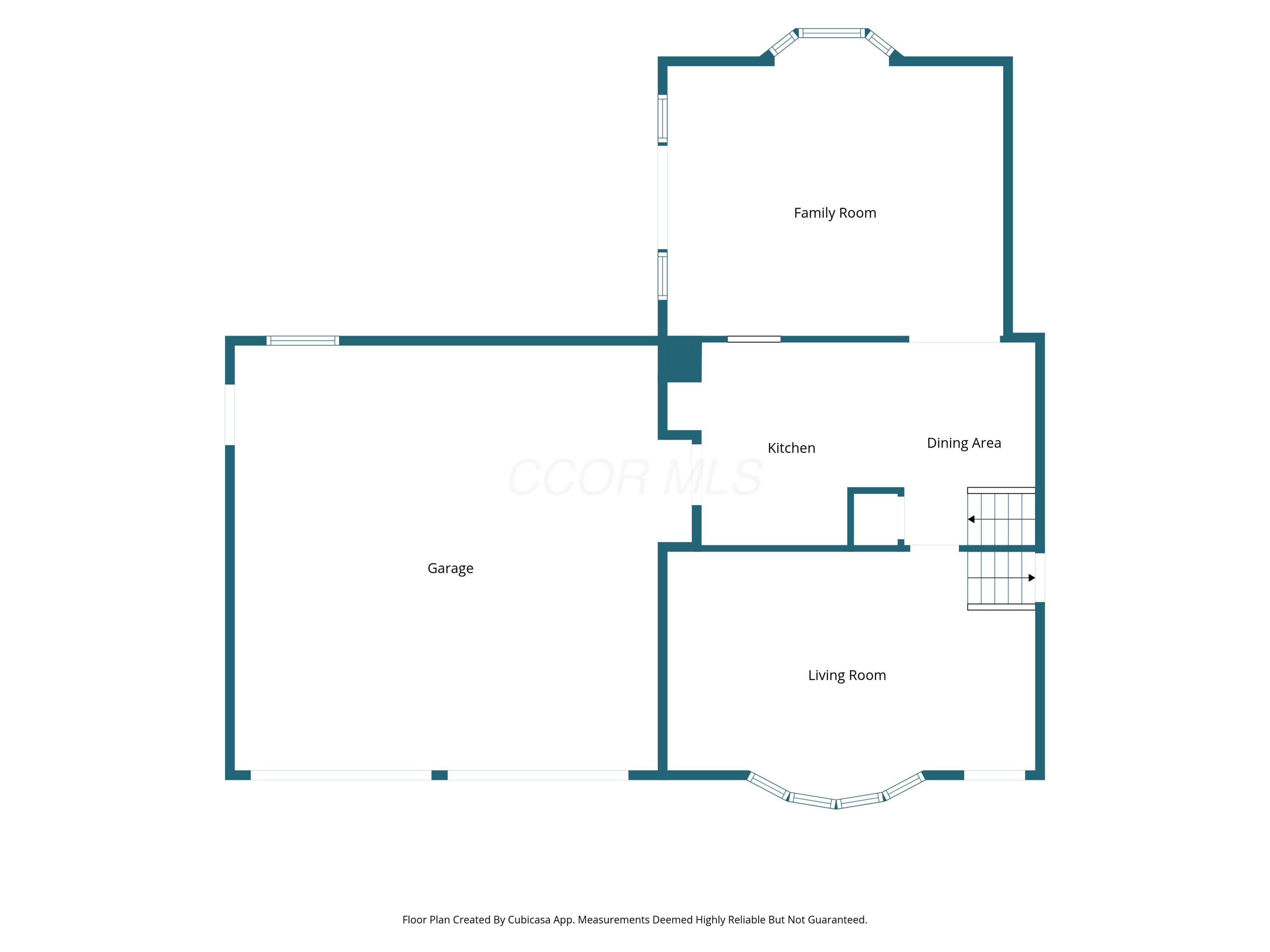 Floor plan showing the garage, family room, kitchen, dining area, and living room.