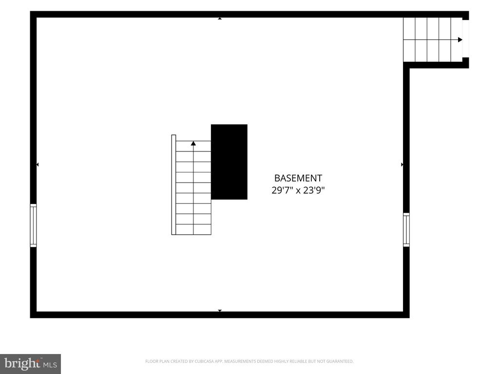 Basement floor plan with central stairwell and dimensions of 29 feet 7 inches by 23 feet 9 inches.