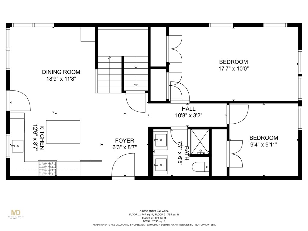 Floor plan with a dining room, kitchen, two bedrooms, bathroom, staircase, room dimensions, and total area of 2,035 square feet.