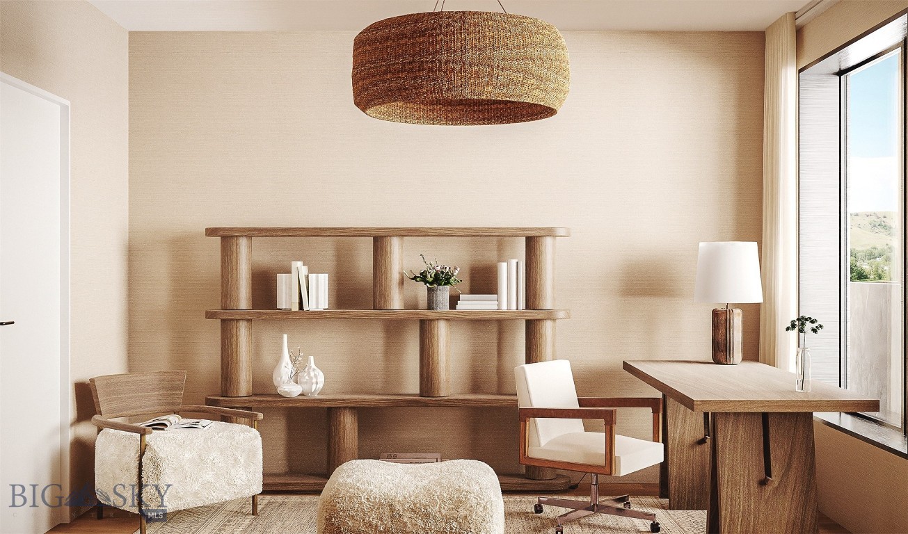Staged home office with wooden desk, open shelving, and tall windows overlooking the landscape.