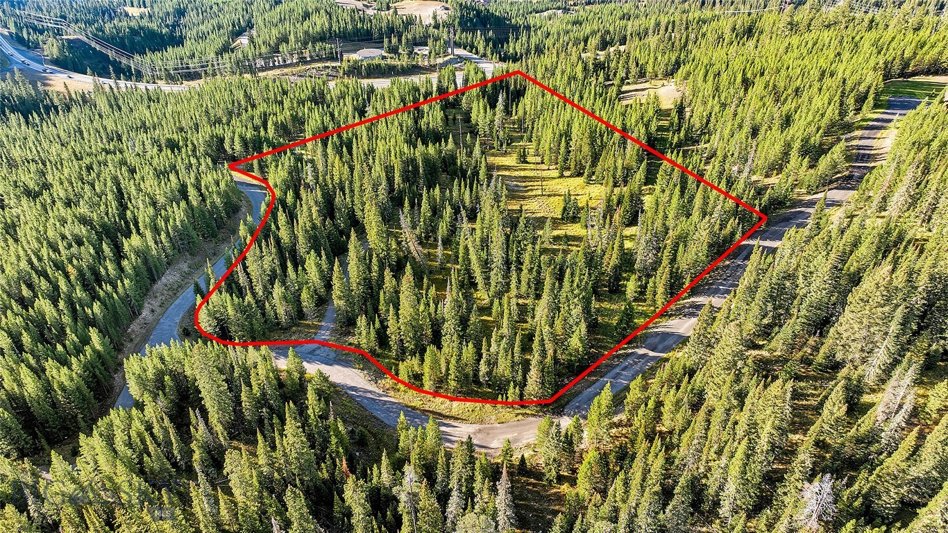 Wooded parcel at 1 Ciel Drive outlined in red, with roads curving around the property.