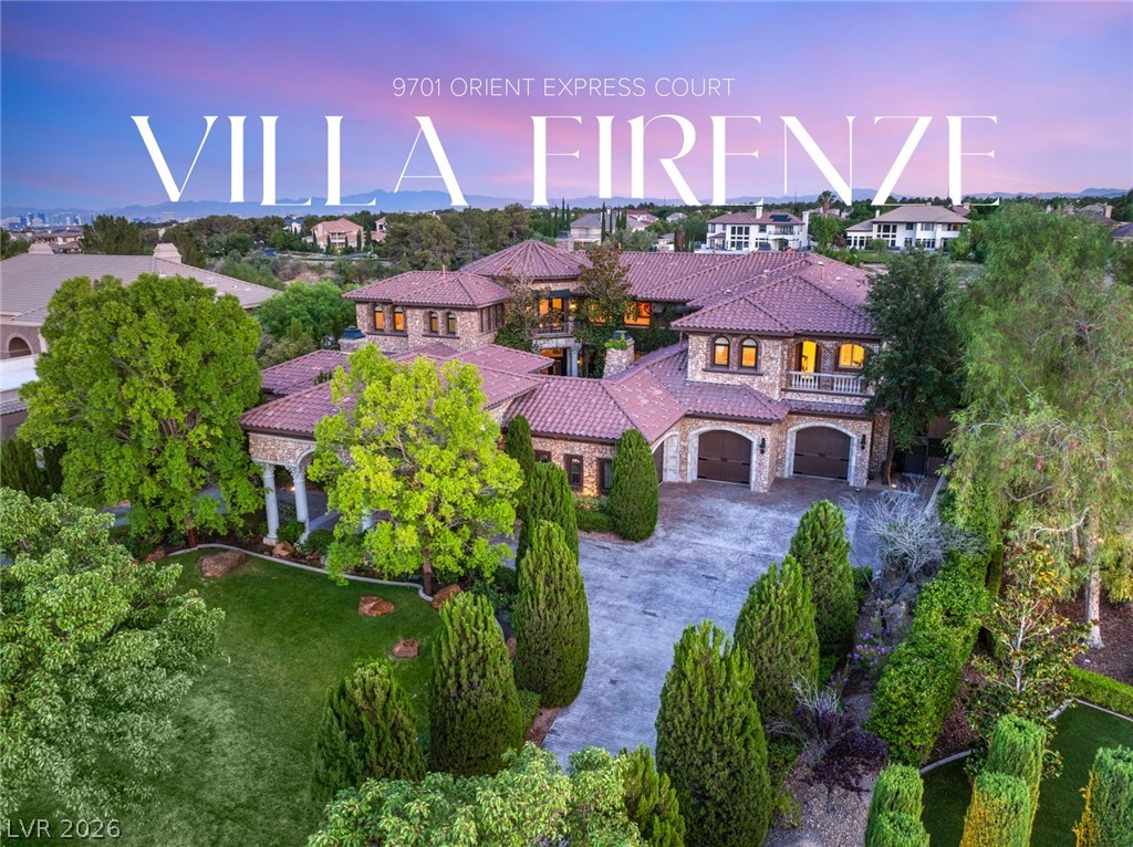 Villa Firenze at dusk, with pink tile roofs, stone walls, and landscaped grounds.