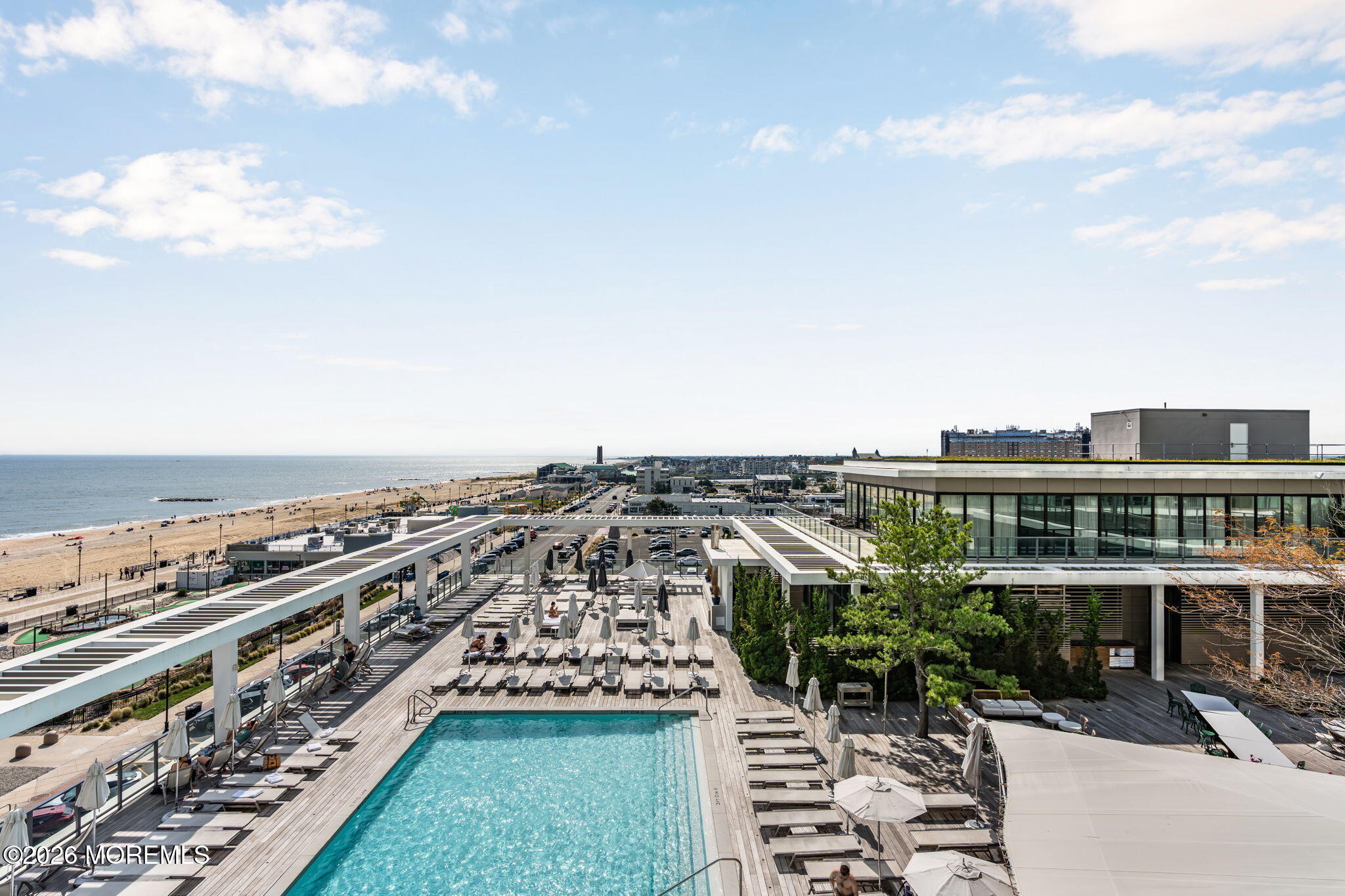 Rooftop pool and lounge deck overlooking the beach and ocean.