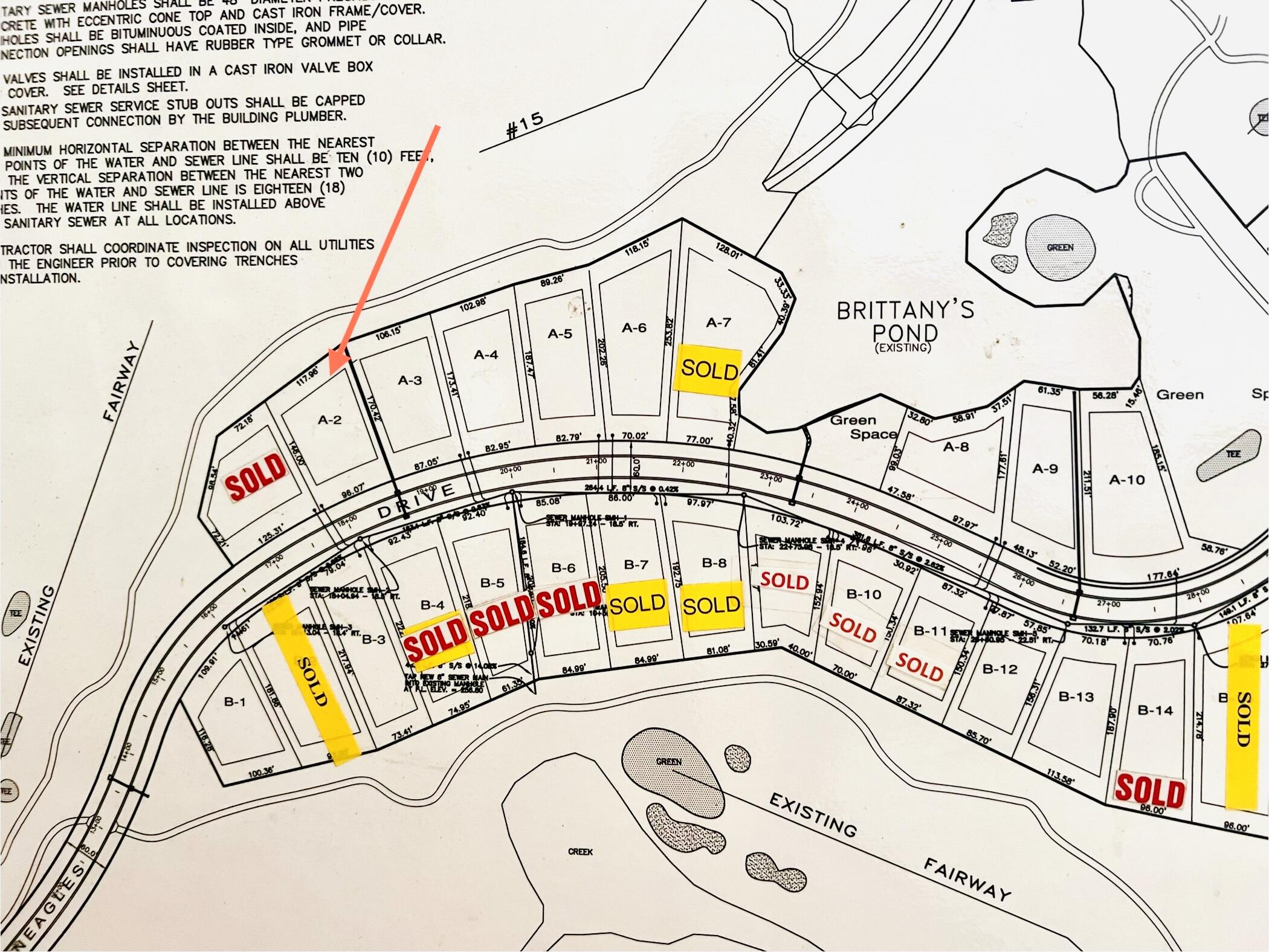 Subdivision map with an orange arrow pointing to lot A-2 beside the fairway.