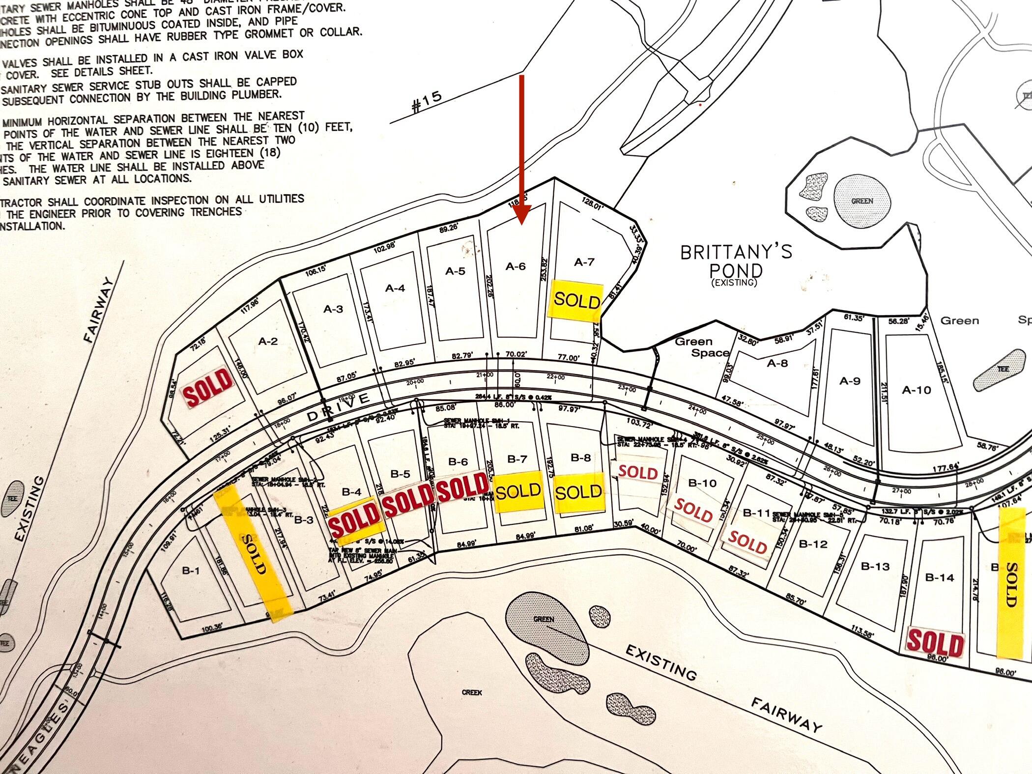 Subdivision plat map with an arrow pointing to lot A-6 beside Brittany’s Pond.