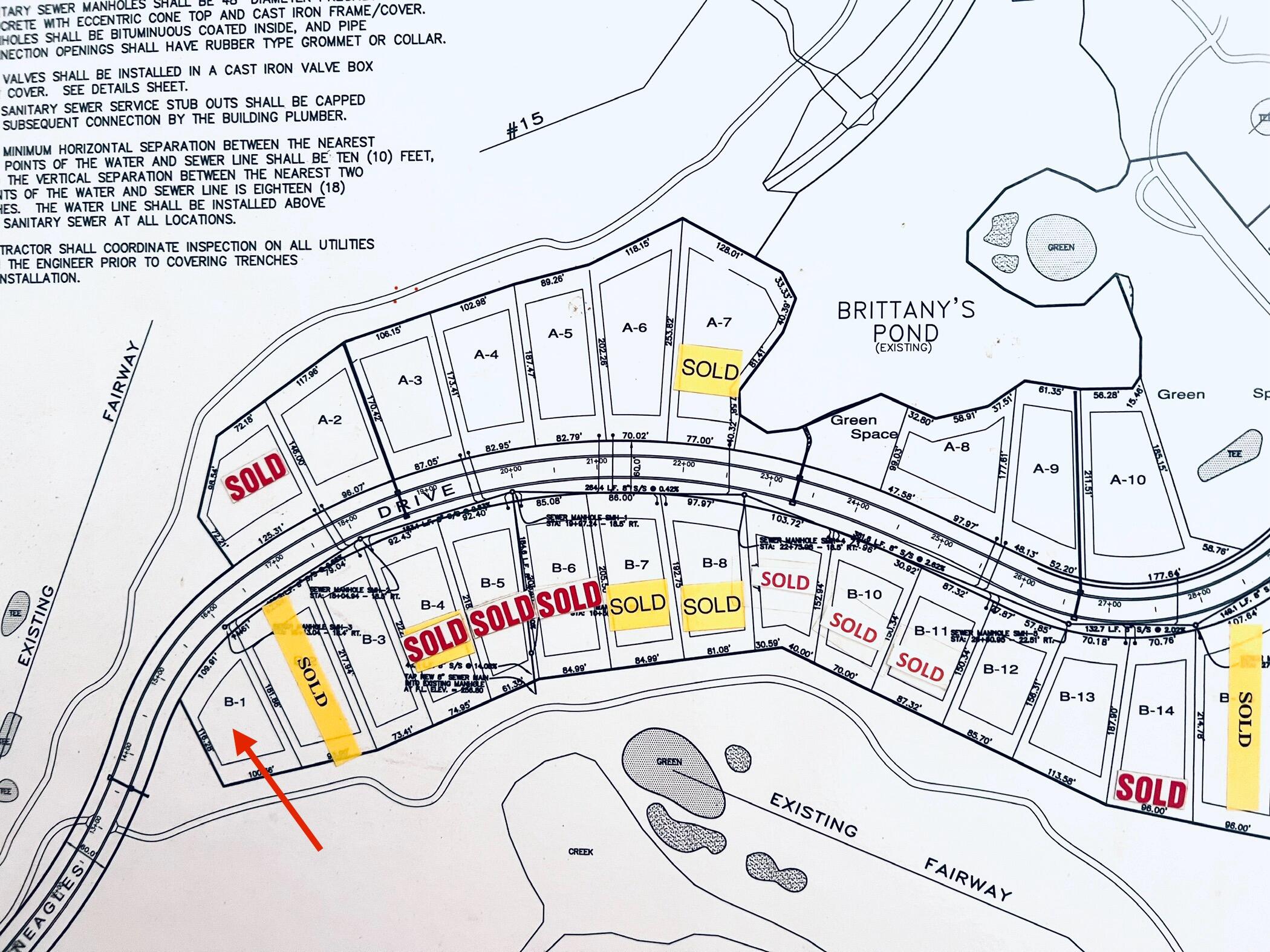 Subdivision lot map with a red arrow pointing to lot B-1 and multiple lots marked sold.