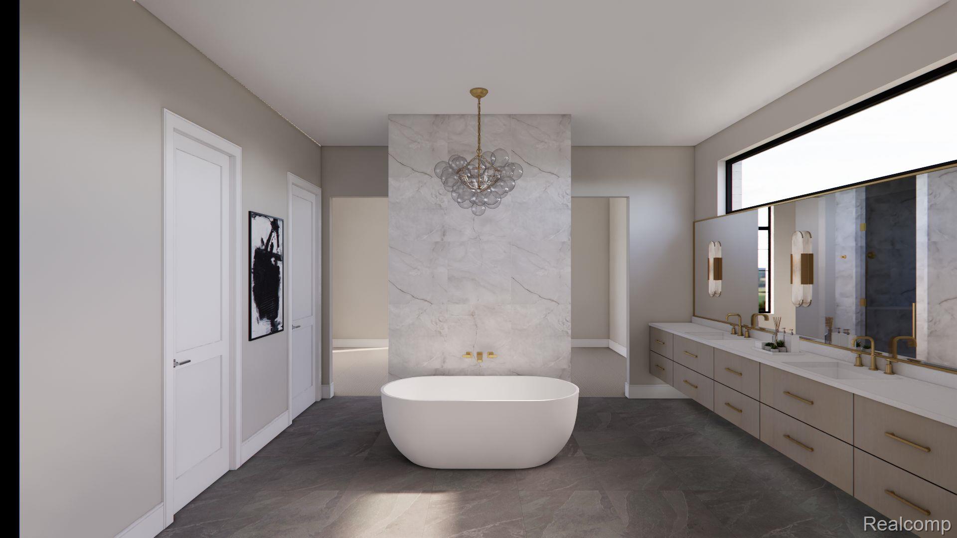 Bathroom with a freestanding tub, marble feature wall, and long double vanity.