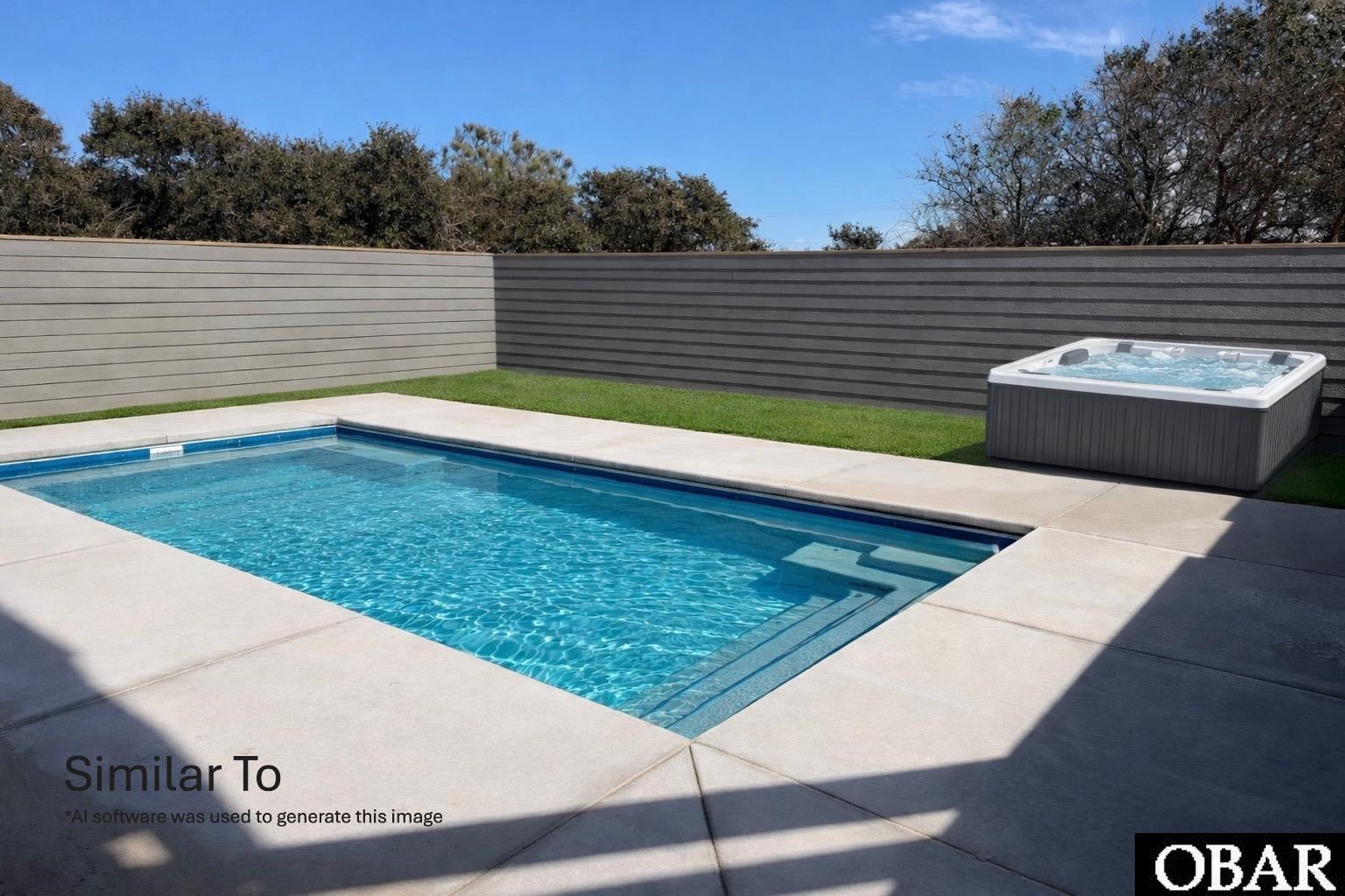 Backyard swimming pool and hot tub enclosed by gray privacy fencing.