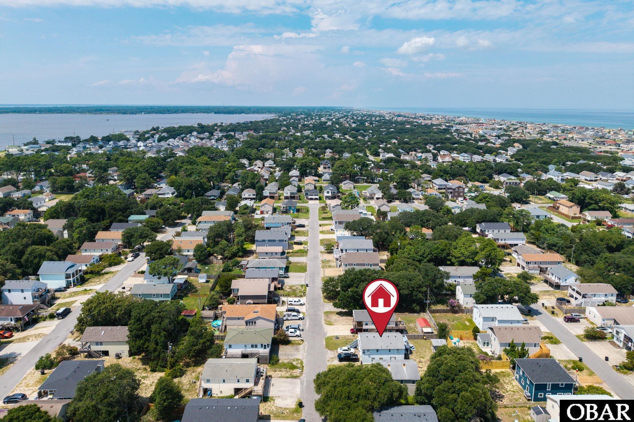 Aerial view of the Yorktown Street property marked among coastal homes between two waterways.