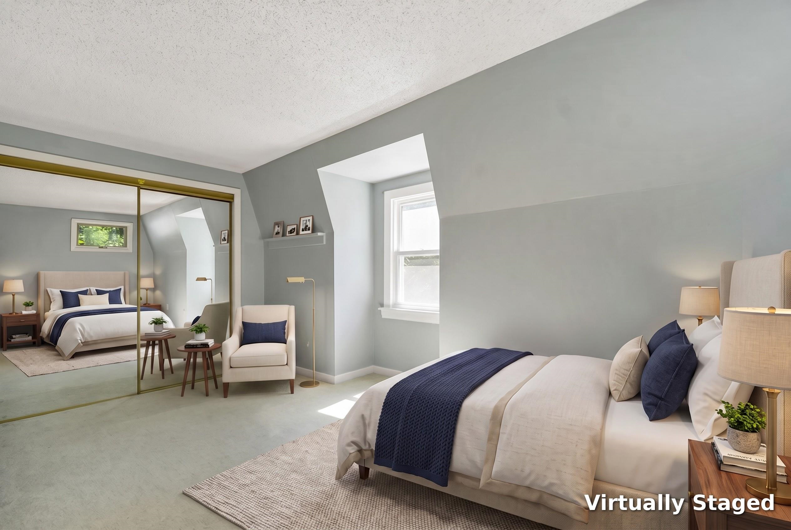 Virtually staged bedroom with a navy-accented bed, mirrored closet doors, and a sloped ceiling.