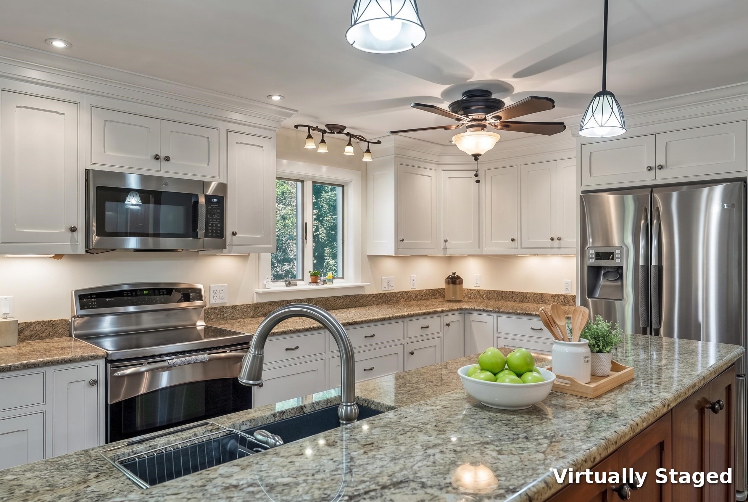 Kitchen with white cabinets, granite counters, a large sink island, and stainless steel appliances.