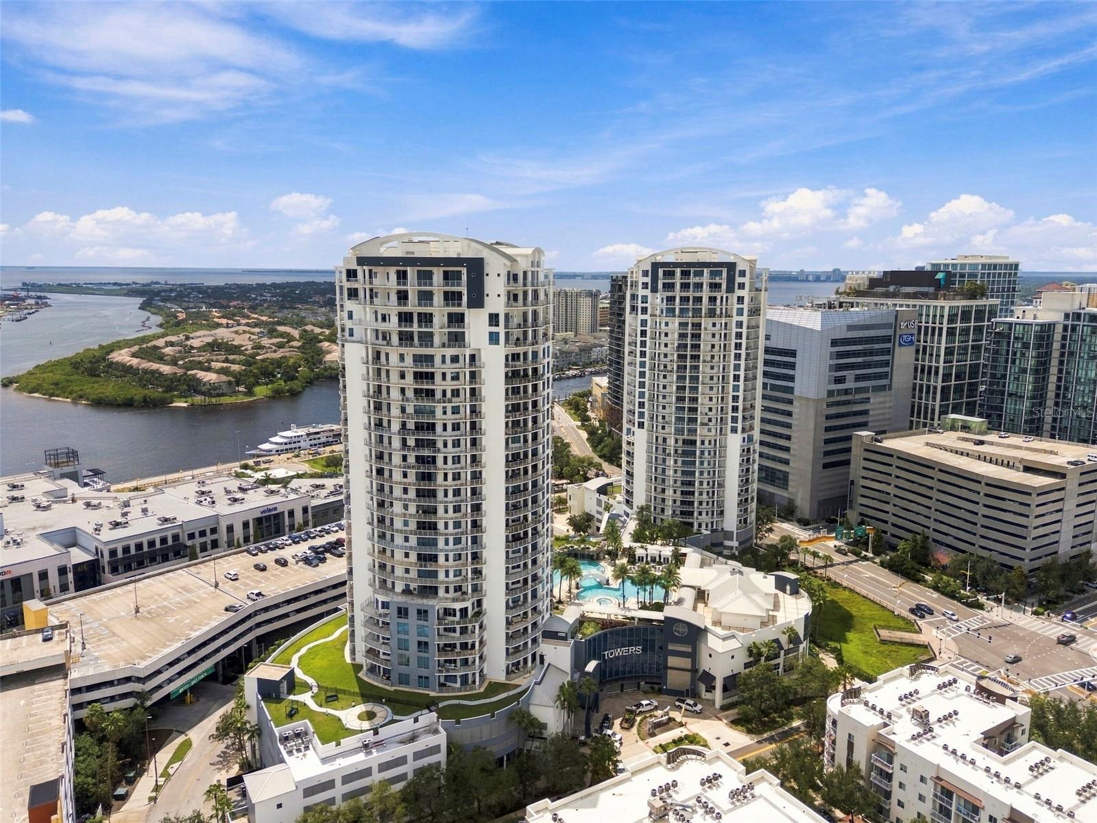 Aerial view of downtown Tampa condominium towers, pool, and Tampa Bay.