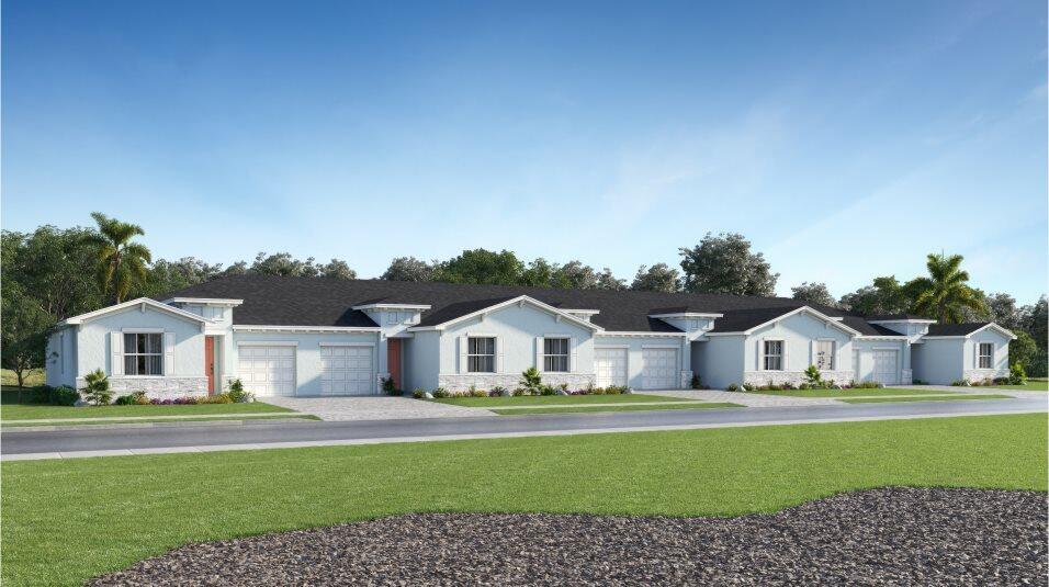 Row of white single-story homes with garages and landscaped front gardens.