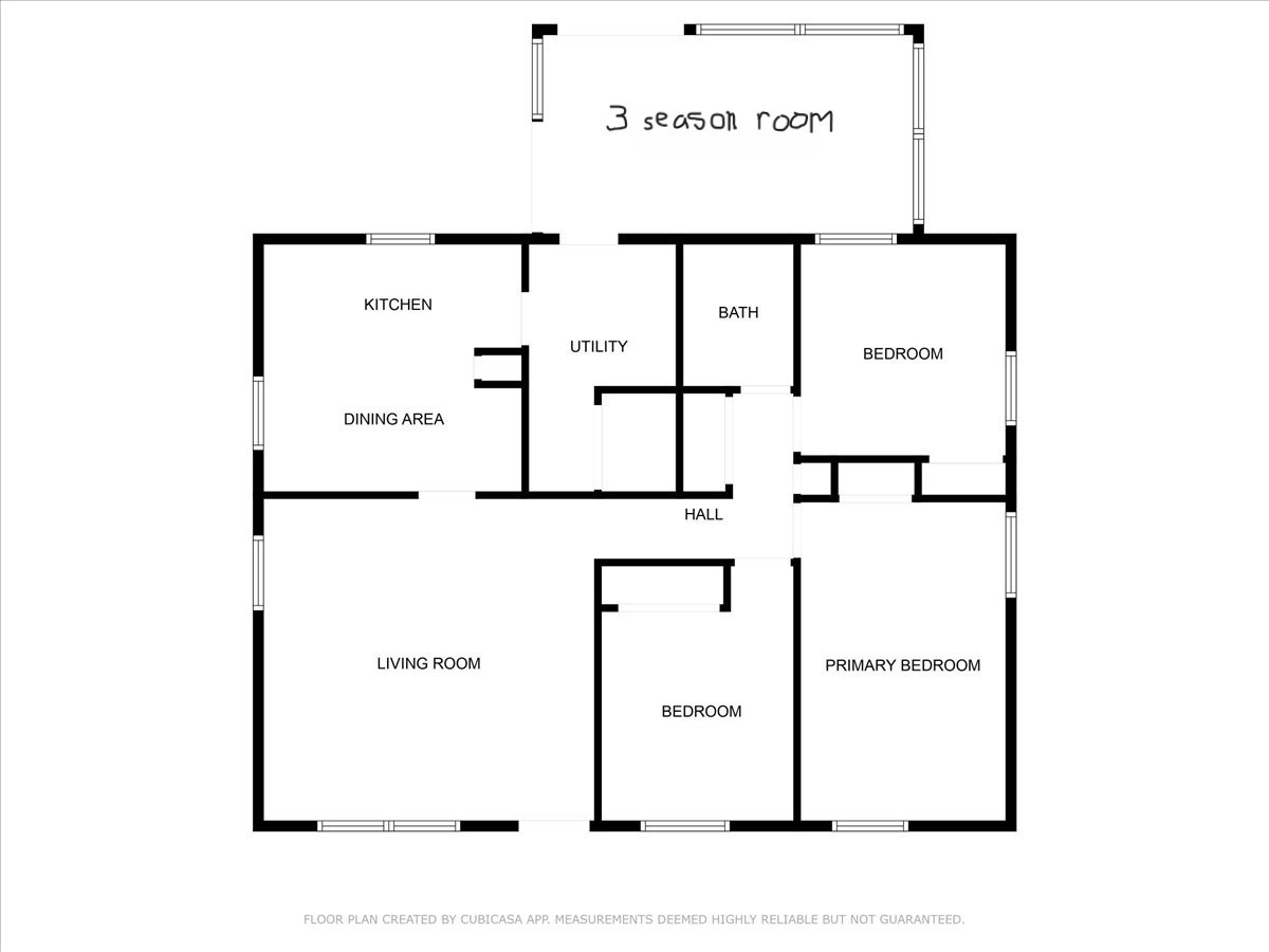 Floor plan showing the home’s kitchen, living room, three bedrooms, bathroom, and three-season room.