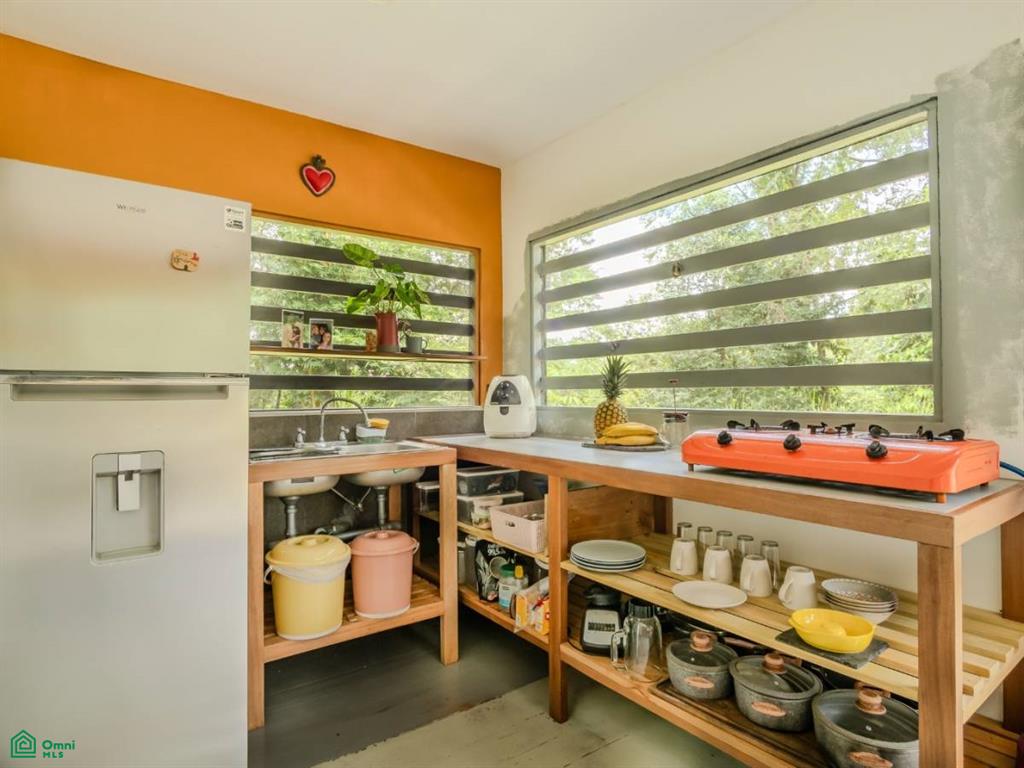 2.2-Acre Mixed-Use Property for Sale in Cinco Ventanas, South Pacific Costa Rica – Container Home, Legal Well & Buildable Terraces