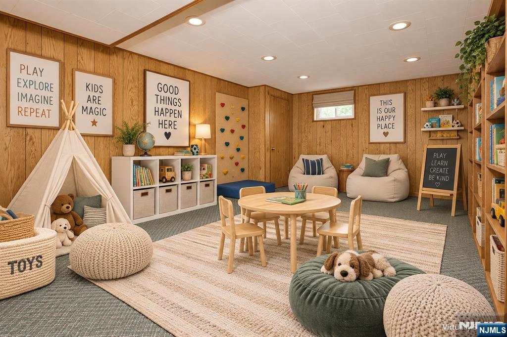 Staged children's playroom with a teepee, toy storage, child-sized table, and plush dog on a green cushion.