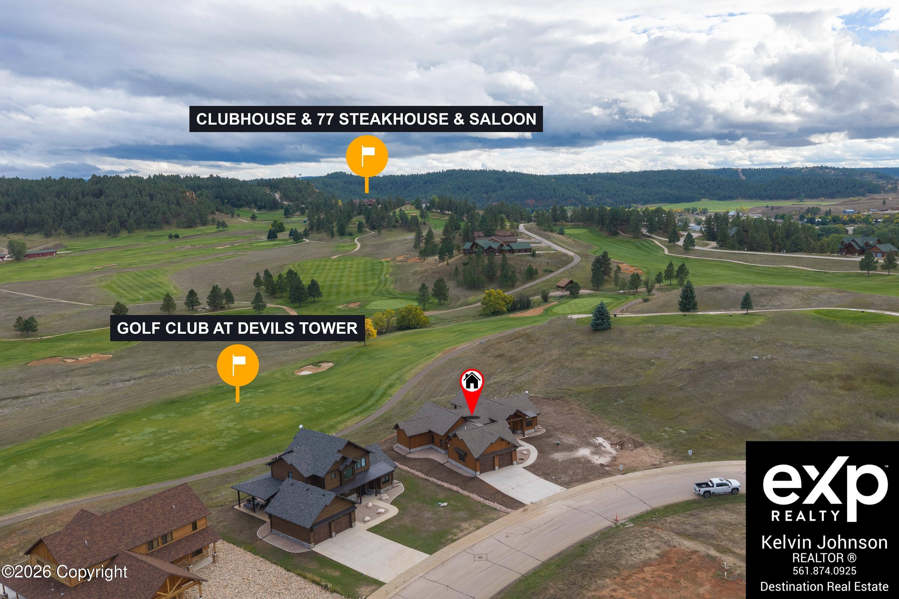 Aerial view of a marked home beside the golf course, with nearby homes and clubhouse labeled.