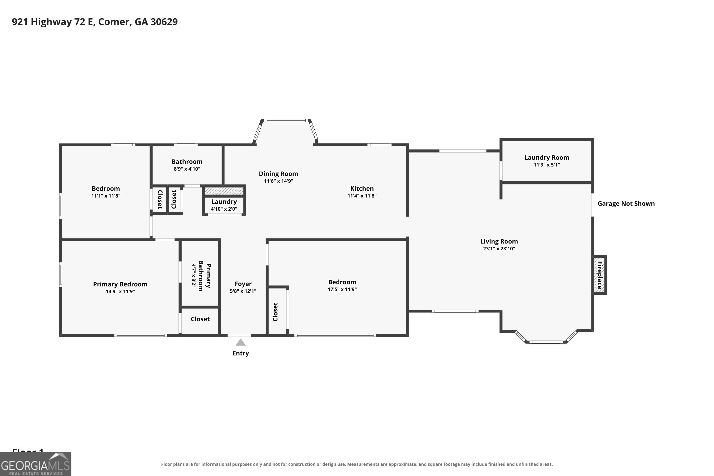 Floor plan showing three bedrooms, two bathrooms, living and dining rooms, kitchen, foyer, laundry areas, and fireplace.