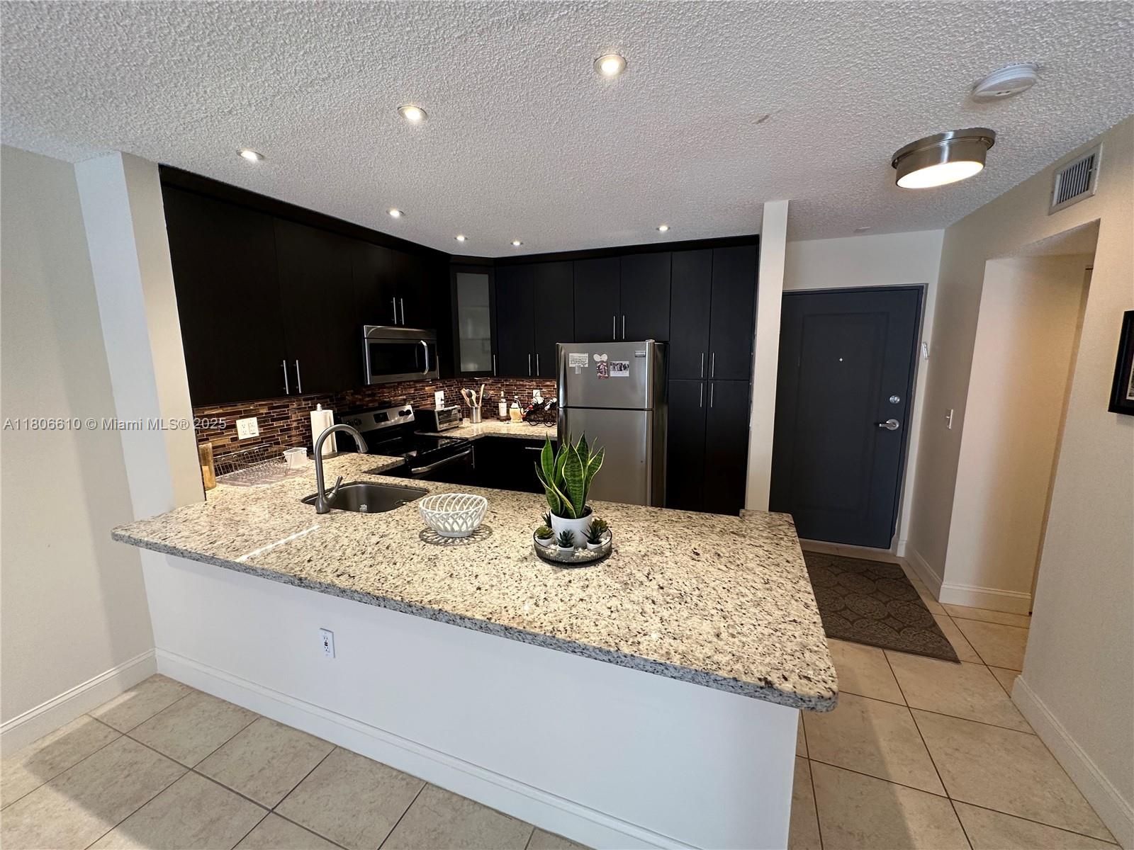7740 Camino Real # 205 Unit: G-205