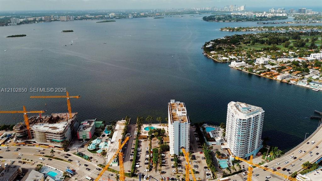 Aerial view of Biscayne Bay and North Bay Village, with waterfront buildings and a causeway.