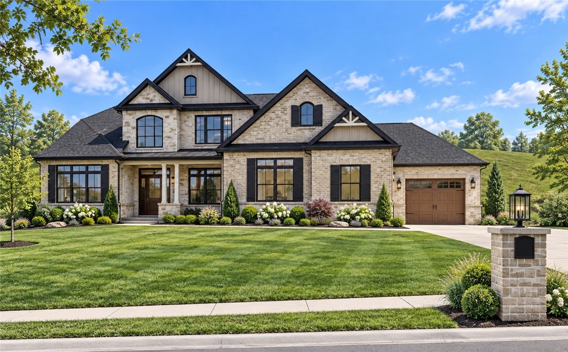 Two-story stone house with multiple gables, an attached garage, and a landscaped lawn.