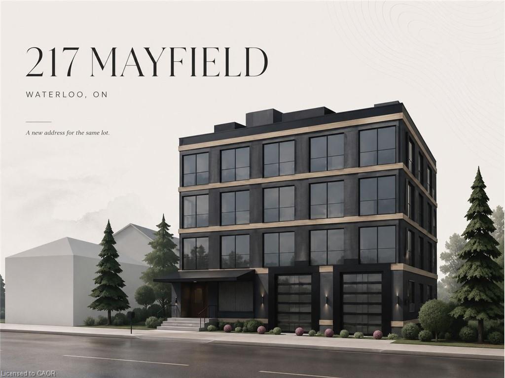 Modern four-storey building with dark façades, large windows, tan trim, and two garage doors.