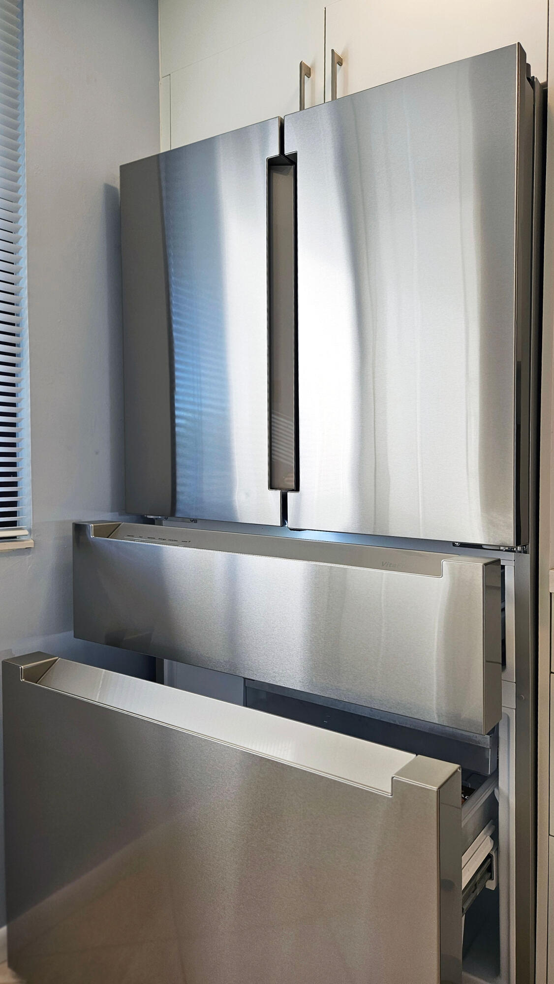 Stainless-steel Viking refrigerator with double doors and pull-out freezer drawers.