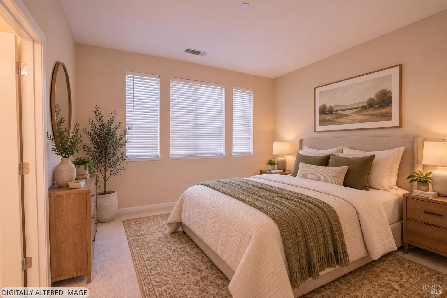 Staged bedroom with a cream bed, olive pillows, three shuttered windows, and warm bedside lighting.