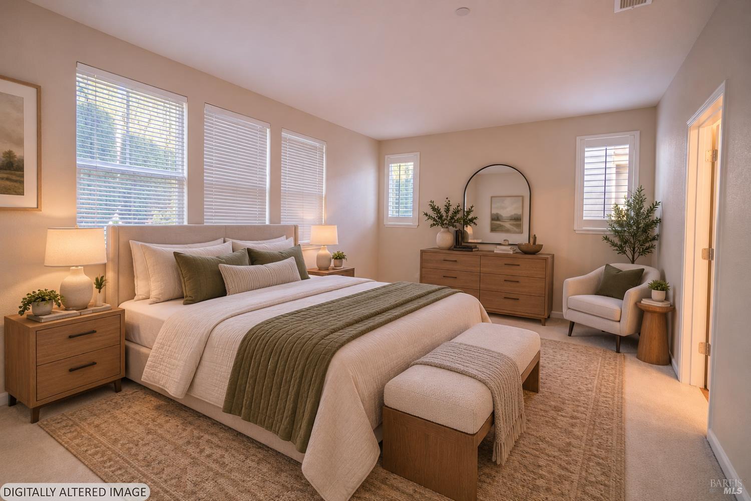 Staged bedroom with a large bed, wood furnishings, and windows with blinds.